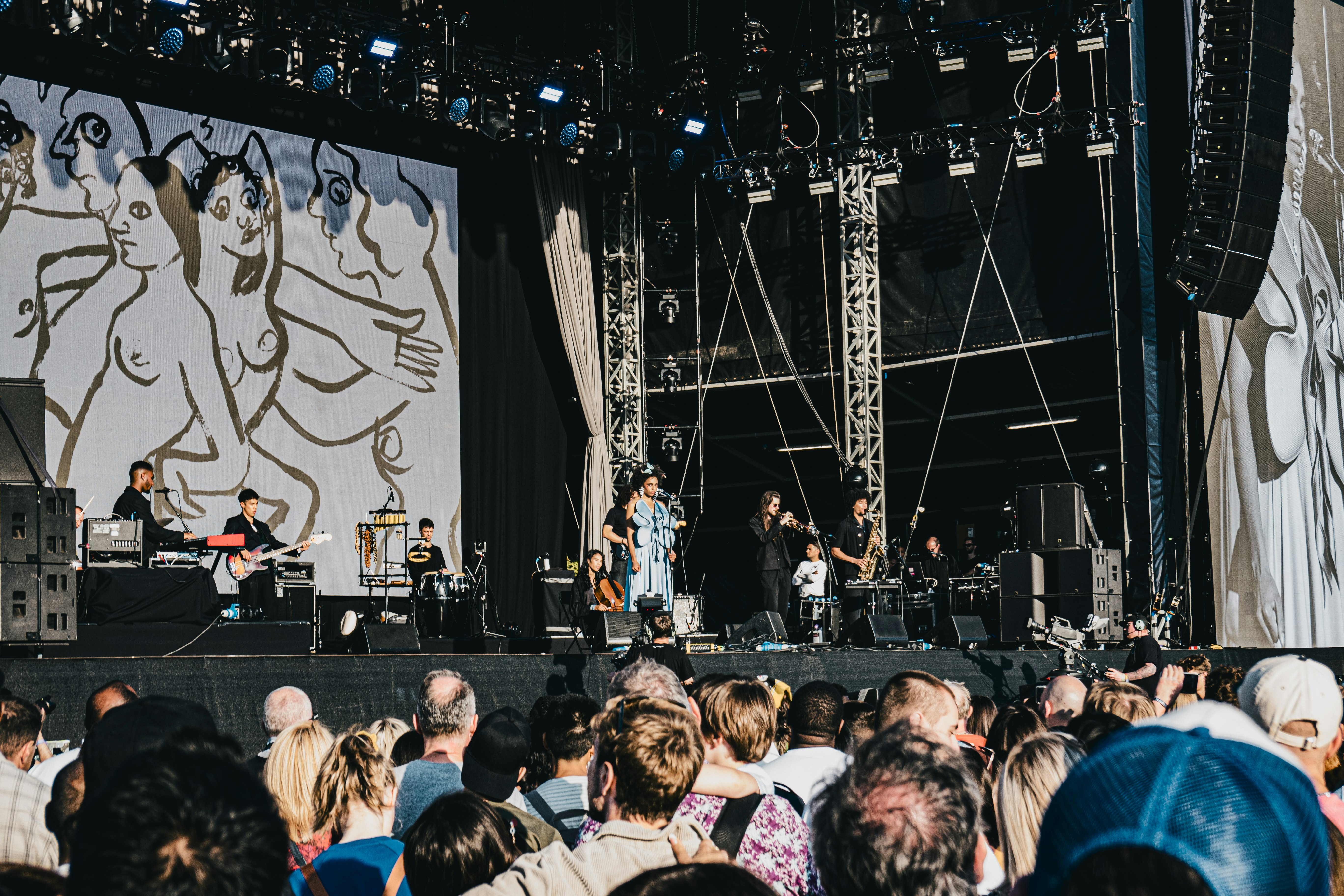 people standing on stage during nighttime